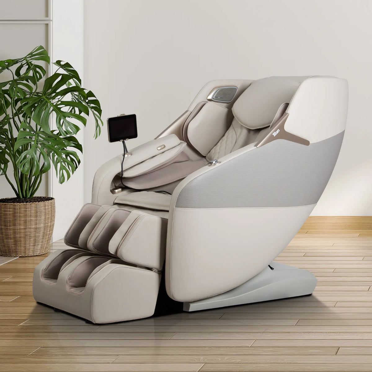 Taupe Titan Pro 4D Astro massage chair in a bright living room beside a potted plant
