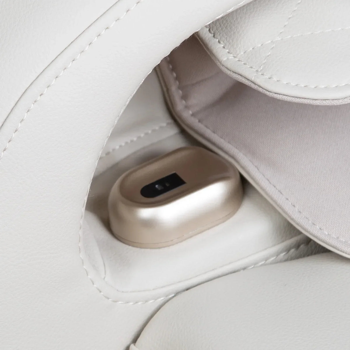 Close-up of the AI health check fingertip sensor on the Titan Pro 4D Astro armrest