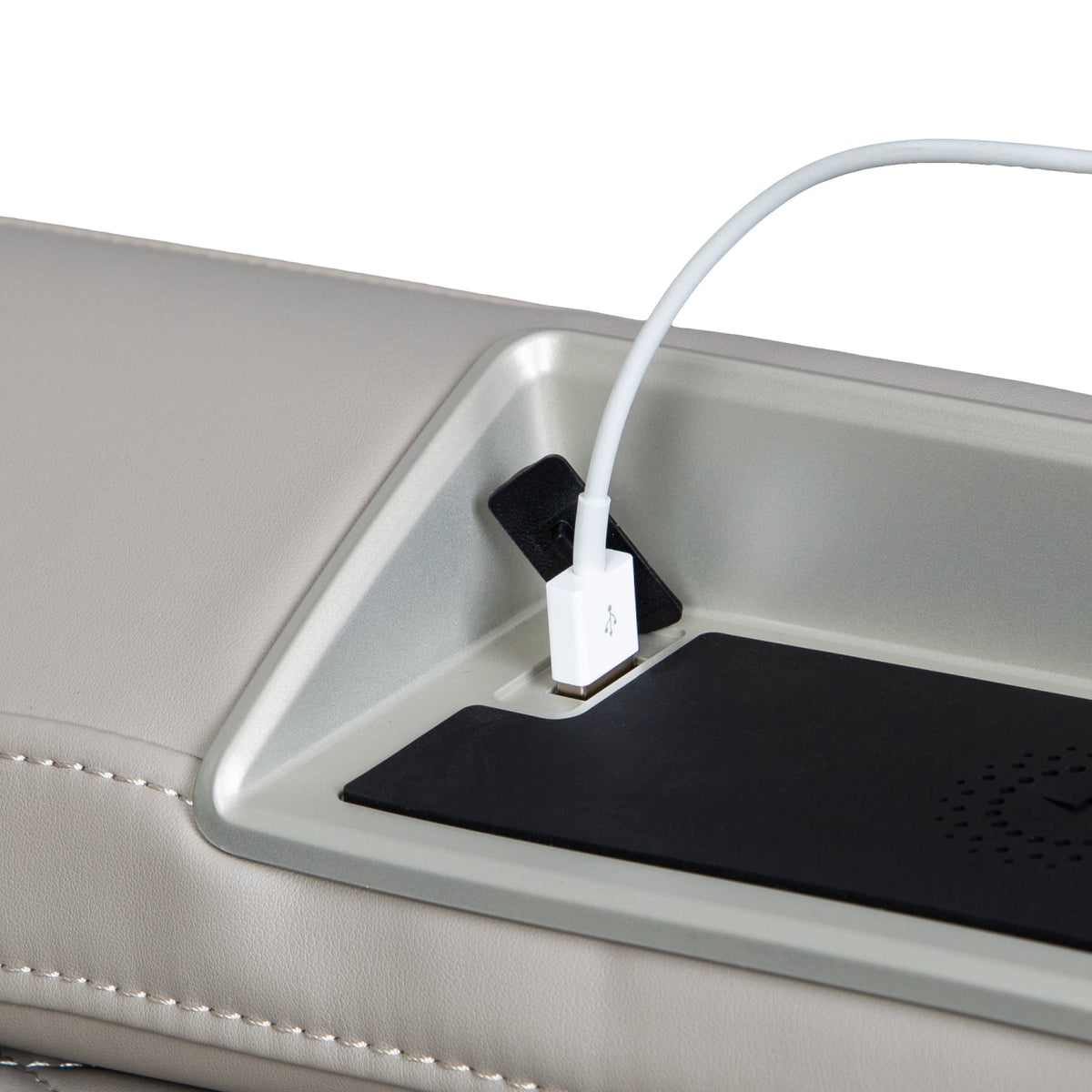 USB cable plugged into the Titan Forma 3D+2D armrest USB charging port