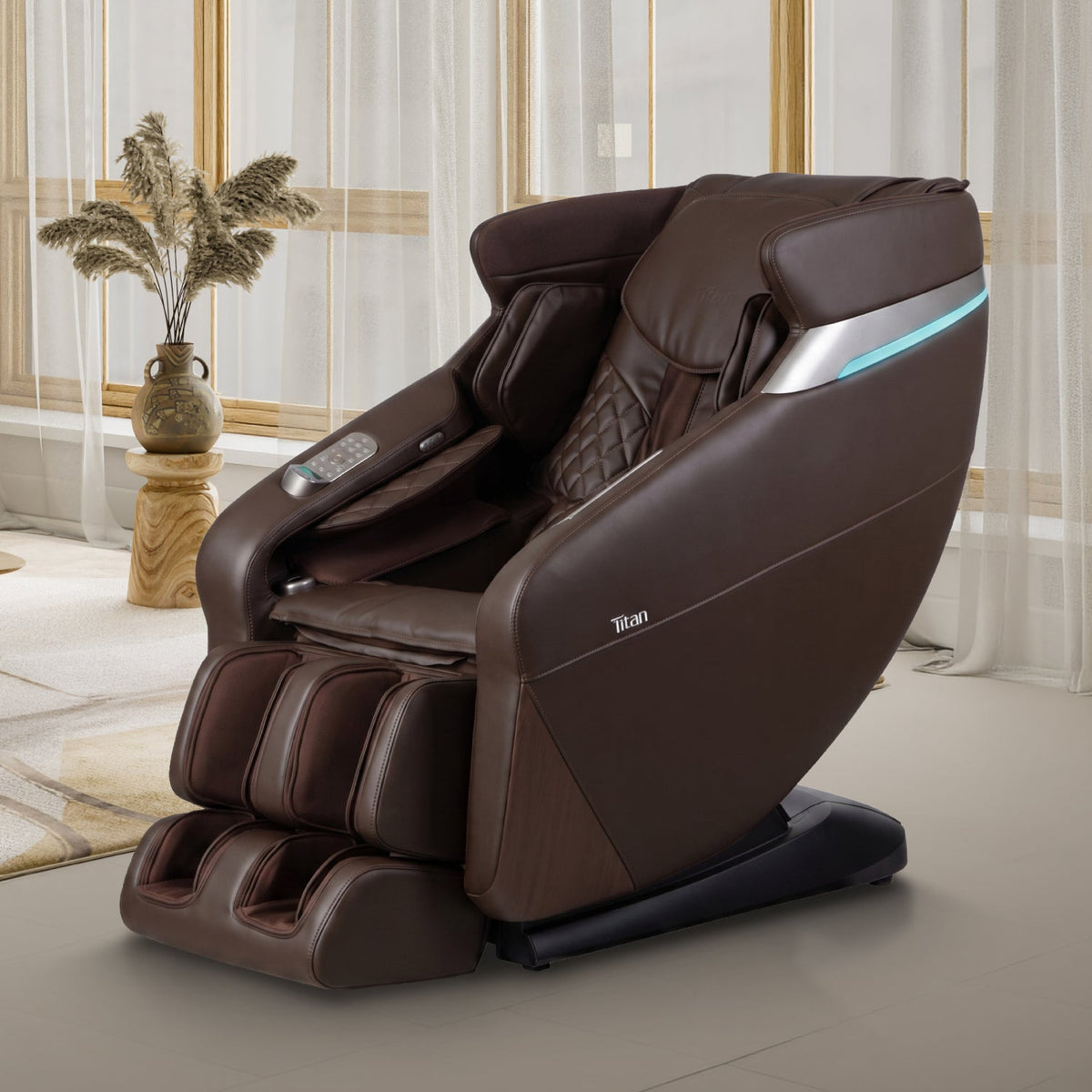 Brown Titan Forma 3D+2D massage chair in a warm living room beside a plant and sheer curtains