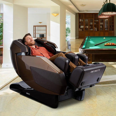 Infinity Imperial Syner-D Massage Chair Dark Brown Angled View Staged with Model