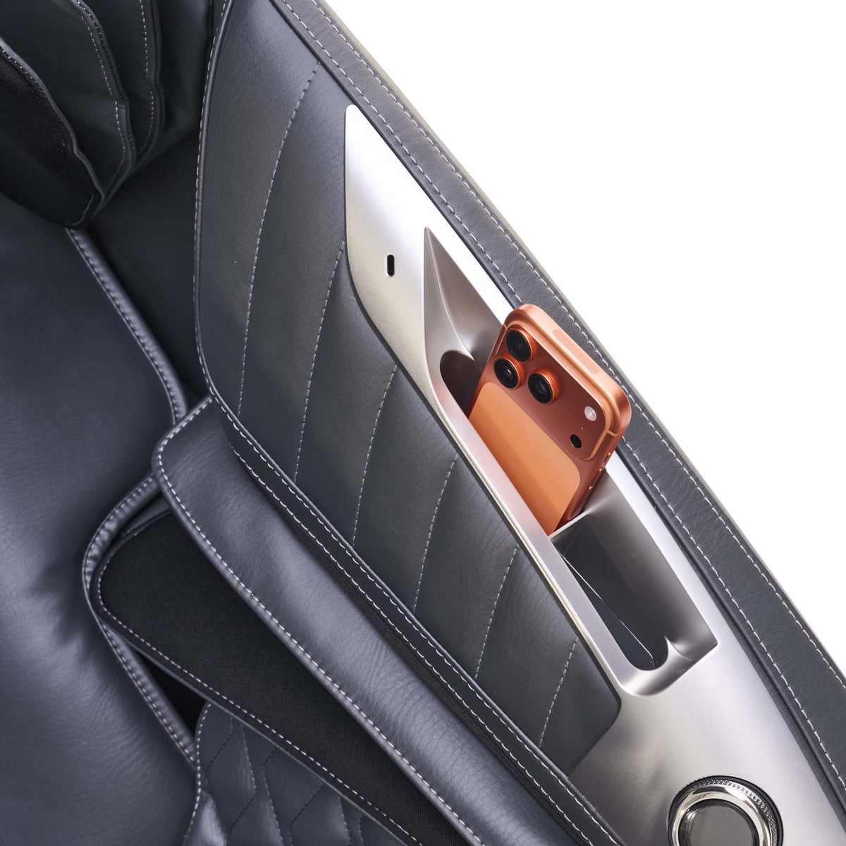 Phone stored in the side pocket organizer of the Human Touch Super Novo 3.0 massage chair